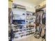 Spacious walk-in closet with ample shelving and storage, perfect for organizing clothes, shoes, and accessories at 9759 E Brown Rd, Mesa, AZ 85207