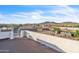 Scenic aerial view showcasing the property's fence, outbuildings and the picturesque landscape with mountains in the distance at 1044 E Irvine Rd, Phoenix, AZ 85086