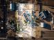 This aerial view captures the expansive property with pool, horse facilities, and multiple outbuildings, set in a scenic landscape at 1044 E Irvine Rd, Phoenix, AZ 85086