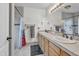 This bathroom has a double sink vanity, large mirror, and neutral tile at 1044 E Irvine Rd, Phoenix, AZ 85086