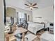 This bedroom features wood-look tile flooring, ceiling fan and a window at 1044 E Irvine Rd, Phoenix, AZ 85086