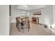 Charming dining area with wood table set, tile floors, and seamless transition to the rest of the home at 1044 E Irvine Rd, Phoenix, AZ 85086