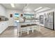 Bright kitchen features white cabinetry, granite countertops, stainless steel appliances, and a center island at 1044 E Irvine Rd, Phoenix, AZ 85086