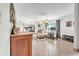 Bright and airy living room showcasing neutral decor, tile flooring, and large windows that flood the space with natural light at 1044 E Irvine Rd, Phoenix, AZ 85086