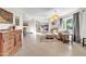 Spacious living room featuring tile flooring, a large window with natural light, and comfortable seating at 1044 E Irvine Rd, Phoenix, AZ 85086