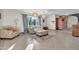 Bright living room with large windows, tile flooring, and stylish furniture creates a welcoming atmosphere at 1044 E Irvine Rd, Phoenix, AZ 85086
