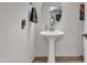 This powder room features a pedestal sink at 1044 E Irvine Rd, Phoenix, AZ 85086
