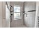 This bathroom has a tiled shower and frosted window at 1044 E Irvine Rd, Phoenix, AZ 85086