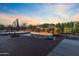Backyard pool at dusk surrounded by native landscaping, creating a tranquil retreat to enjoy the sunset at 1044 E Irvine Rd, Phoenix, AZ 85086