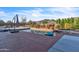 Outdoor swimming pool in a desert landscape, designed for relaxation and enjoyment under the clear blue sky at 1044 E Irvine Rd, Phoenix, AZ 85086