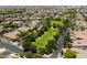Aerial view of neighborhood park with play area, swing set and covered seating area at 10618 E Kinetic Dr, Mesa, AZ 85212