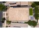 An aerial view showing a tile roof, backyard with synthetic grass, desert landscaping and a pergola at 10618 E Kinetic Dr, Mesa, AZ 85212
