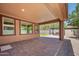 Inviting covered back patio with a seating area, perfect for outdoor relaxation and entertaining at 10618 E Kinetic Dr, Mesa, AZ 85212