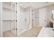 Clean, bright bathroom features a walk-in shower, separate soaking tub, and walk-in closet at 10618 E Kinetic Dr, Mesa, AZ 85212