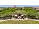 Community park amenity featuring a covered seating area, seating and desert landscaping at 10618 E Kinetic Dr, Mesa, AZ 85212