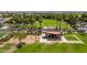 Aerial view of the community park featuring a playground, picnic pavilion and green spaces surrounded by palm trees at 10618 E Kinetic Dr, Mesa, AZ 85212