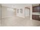 The empty dining area is bright and spacious and has a view into the living room at 10618 E Kinetic Dr, Mesa, AZ 85212