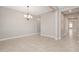 Clean, bright dining room with neutral walls, tile floors, and recessed lighting at 10618 E Kinetic Dr, Mesa, AZ 85212