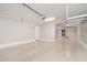 Spacious garage with epoxy flooring and ample overhead storage, perfect for organization at 10618 E Kinetic Dr, Mesa, AZ 85212