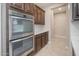 Gourmet kitchen features stainless steel double ovens and plenty of cabinet space at 10618 E Kinetic Dr, Mesa, AZ 85212