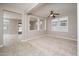 The living room has an open design with neutral colors and an abundance of natural light at 10618 E Kinetic Dr, Mesa, AZ 85212