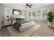 Serene primary bedroom featuring lots of natural light and contemporary furnishings at 10618 E Kinetic Dr, Mesa, AZ 85212