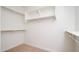 Walk-in closet offers ample storage space with shelving and hanging rods at 10618 E Kinetic Dr, Mesa, AZ 85212