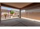 An inviting covered back patio with concrete flooring and a built-in grill area, perfect for outdoor entertaining at 10910 E Sebring Ave, Mesa, AZ 85212
