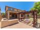 Backyard with a built-in grill, covered patio, and pergola-covered fire pit offers ultimate outdoor living at 10910 E Sebring Ave, Mesa, AZ 85212
