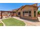 Spacious backyard with pergola, barbecue, fire pit and artificial turf area at 10910 E Sebring Ave, Mesa, AZ 85212