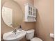 Powder bathroom with pedestal sink, medicine cabinet, and neutral wall color at 10910 E Sebring Ave, Mesa, AZ 85212