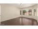 Spacious bedroom with wood floors and windows bringing in natural light at 10910 E Sebring Ave, Mesa, AZ 85212