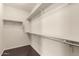 Walk-in closet with hardwood floors and shelving at 10910 E Sebring Ave, Mesa, AZ 85212