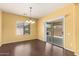 Bright dining room with sliding door leading to backyard and updated light fixture at 10910 E Sebring Ave, Mesa, AZ 85212