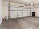 Spacious garage with a white door at 10910 E Sebring Ave, Mesa, AZ 85212