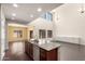 Bright kitchen with center island, modern stainless steel appliances, and open floor plan at 10910 E Sebring Ave, Mesa, AZ 85212