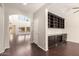 Bright, spacious living area with hardwood floors, built in shelves, and large windows at 10910 E Sebring Ave, Mesa, AZ 85212