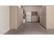 Basement storage featuring multiple cabinets and a refrigerator at 10910 E Sebring Ave, Mesa, AZ 85212
