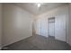 Comfortable bedroom featuring carpet, ceiling fan, bright window and a closet at 11548 W Cottonwood Ln, Avondale, AZ 85392