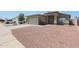 Inviting single-story home with a two-car garage and desert landscaping at 11548 W Cottonwood Ln, Avondale, AZ 85392