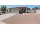 Charming single-story home featuring a two-car garage and low maintenance desert landscaping at 11548 W Cottonwood Ln, Avondale, AZ 85392