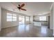 Spacious living area with an open kitchen and access to the outdoor patio at 11548 W Cottonwood Ln, Avondale, AZ 85392
