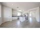 Well-lit kitchen with white cabinets, stainless steel appliances, and a central island at 11548 W Cottonwood Ln, Avondale, AZ 85392