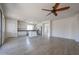 Bright, open kitchen with stainless steel appliances, a central island, and an adjacent living space at 11548 W Cottonwood Ln, Avondale, AZ 85392