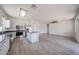 Open kitchen with stainless steel appliances, central island, and spacious layout at 11548 W Cottonwood Ln, Avondale, AZ 85392