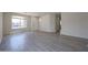 Open living room with wood-look floors and natural light near the front door at 11548 W Cottonwood Ln, Avondale, AZ 85392