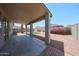 Covered patio with desert landscaping featuring brick and rock features at 11548 W Cottonwood Ln, Avondale, AZ 85392