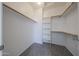 Bright walk-in closet with shelving, rod, and carpeted floor offering ample storage at 11548 W Cottonwood Ln, Avondale, AZ 85392