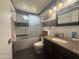 Bathroom with shower, bathtub, decorative mirror and granite countertops at 1226 W Purdue Ave, Phoenix, AZ 85021