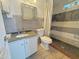 Well-maintained bathroom featuring a vanity, toilet, and tiled walk-in shower at 1226 W Purdue Ave, Phoenix, AZ 85021